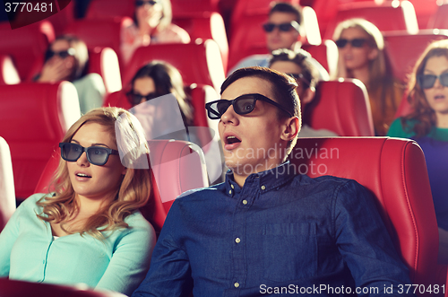 Image of friends watching horror movie in 3d theater