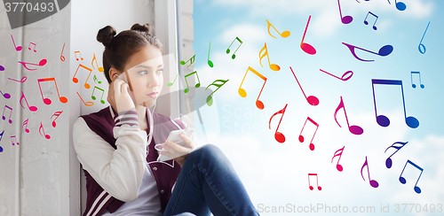 Image of teenage girl with smartphone and earphones