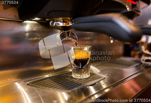 Image of close up of espresso machine making coffee