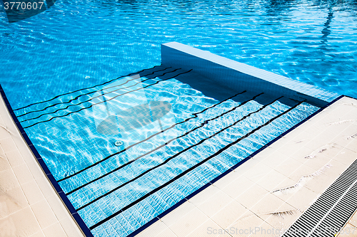 Image of Stairs clear blue swimming pool