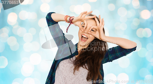 Image of happy teenage girl making face and having fun