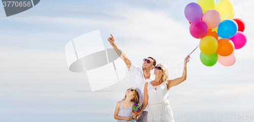 Image of family with colorful balloons