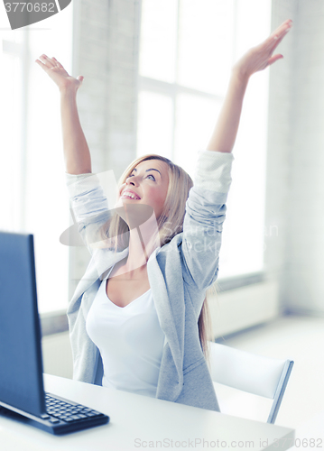 Image of successful businesswoman in office