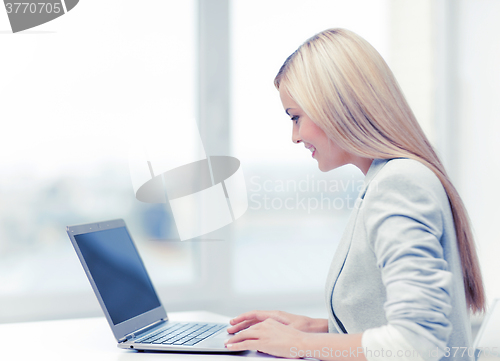 Image of businesswoman with laptop