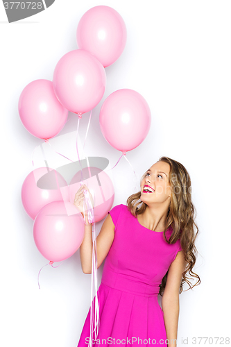 Image of happy young woman or teen girl in pink dress