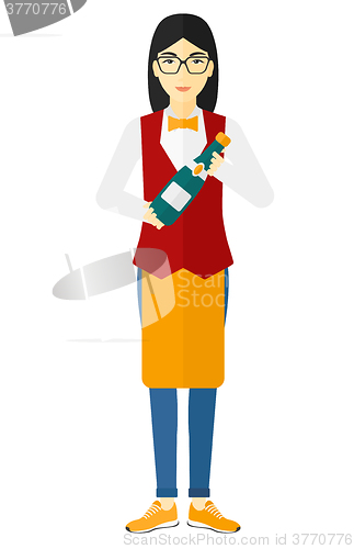 Image of Waiteress holding bottle of wine.