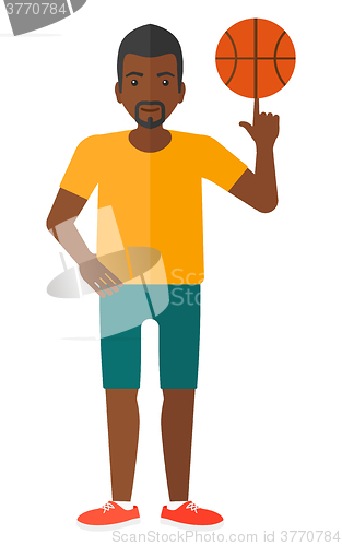 Image of Basketball player spinning ball.