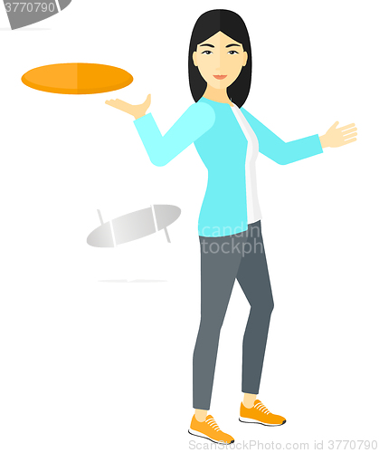 Image of Woman playing frisbee.