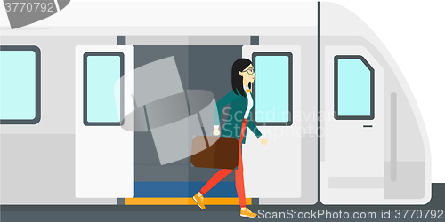 Image of Woman going out of train.