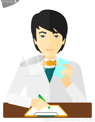 Image of Pharmacist taking notes.