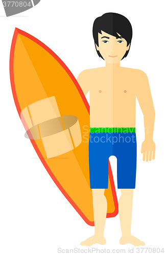 Image of Surfer holding surfboard.