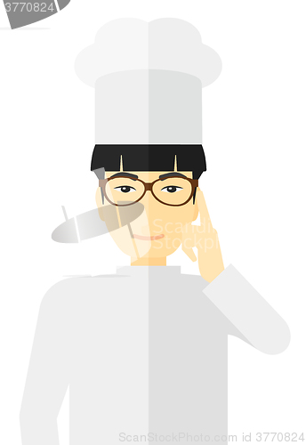 Image of Chef pointing forefinger up.