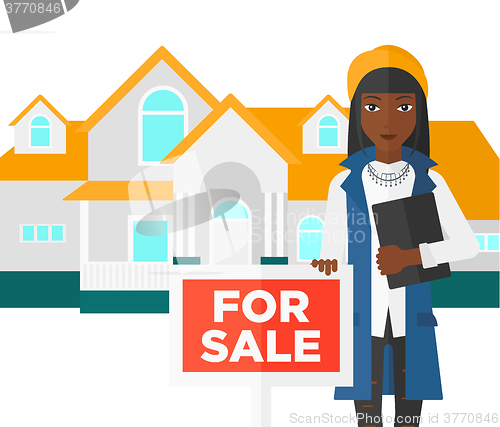 Image of Real estate agent offering house.