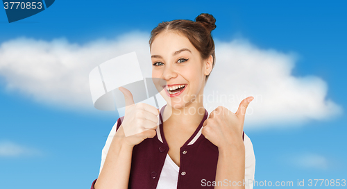 Image of happy smiling teenage girl showing thumbs up