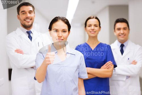 Image of medics or doctors at hospital showing thumbs up