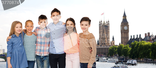 Image of happy smiling children hugging over london