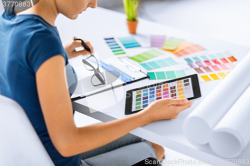 Image of woman working with color samples for selection