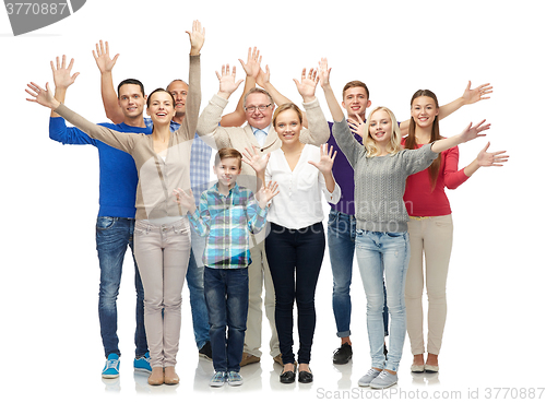 Image of group of smiling people waving hands