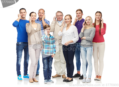 Image of group of smiling people with smartphones