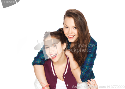 Image of happy smiling pretty teenage girls hugging