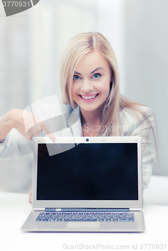 Image of businesswoman with laptop computer