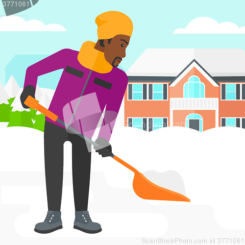 Image of Man shoveling and removing snow.