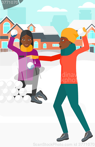 Image of Women playing in snowballs.