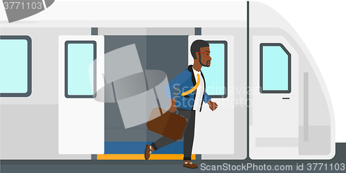 Image of Man going out of train.