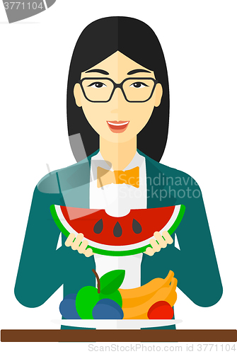 Image of Woman eating watermelon.