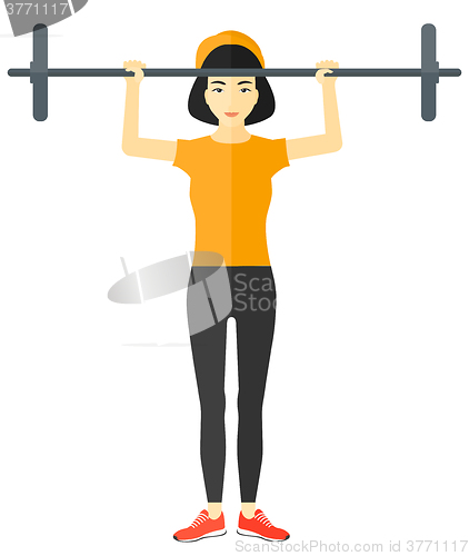 Image of Woman lifting barbell.