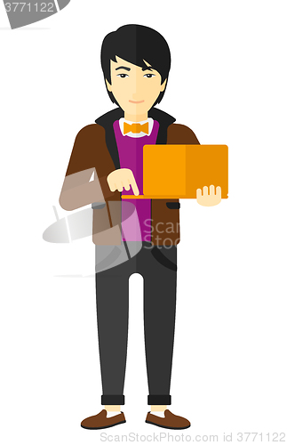 Image of Man using laptop.