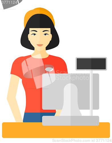 Image of Saleslady standing at checkout.