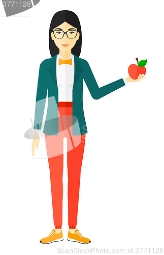 Image of Woman holding apple.