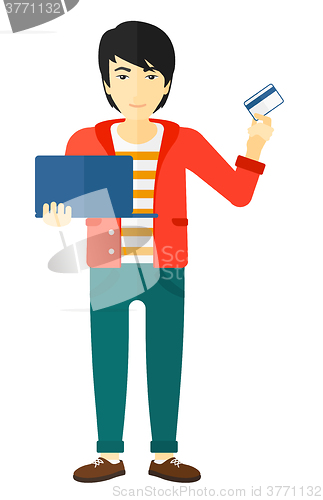 Image of Man making purchases online.