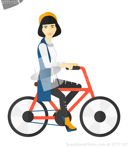 Image of Woman riding bicycle.