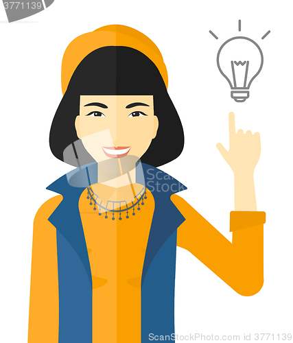 Image of Woman pointing at light bulb.