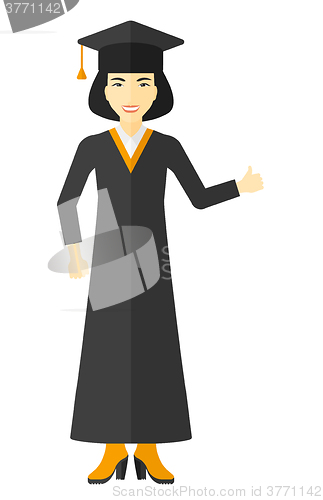 Image of Graduate showing thumb up sign.