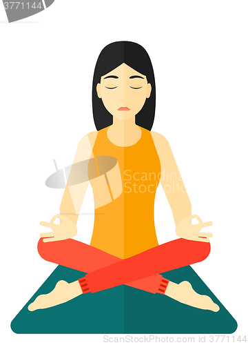 Image of Woman meditating in lotus pose.