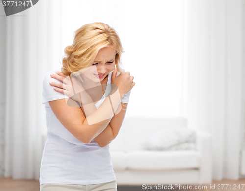 Image of unhappy woman suffering from pain or violence