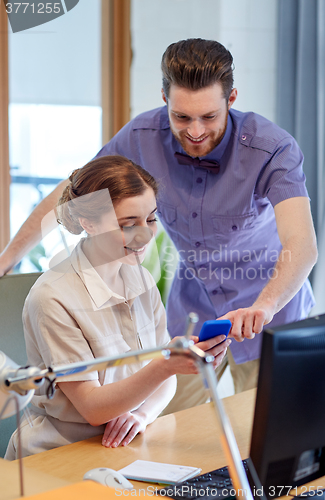 Image of business team with smartphone in office