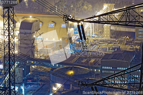 Image of power station at night with smoke 