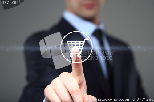 Image of business, technology, internet and networking concept. businessman touching virtual shopping cart.