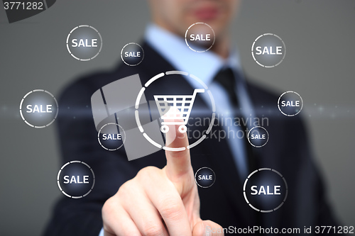 Image of business, technology, internet and networking concept. businessman touching virtual shopping cart.