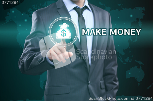 Image of business, technology, internet concept - businessman pressing make money button on virtual screens