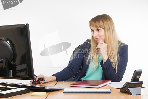 Image of Haughty a specialist office working on the computer