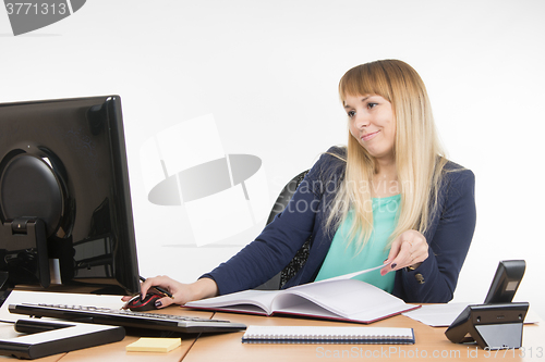 Image of Haughty a specialist office working on the computer