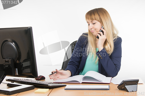 Image of Business woman talking on the phone and understands that a planned meeting did not take place