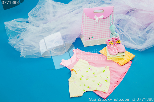 Image of The baby clothes with a  gift box