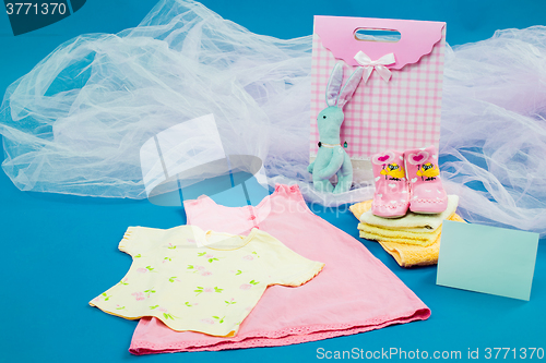 Image of The baby clothes with a  gift box