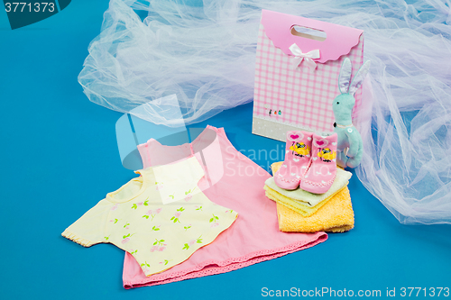 Image of The baby clothes with a  gift box